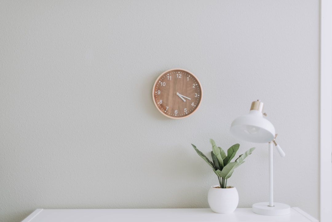 Illustration of a mindful productivity system with a journal, clock, and tea on a calm desk